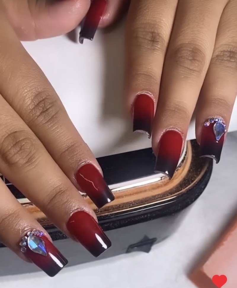 Beautiful red-to-black ombre nails with rhinestones by M & G Dominican Nails Studio